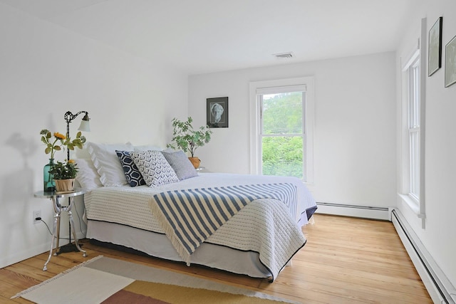 2 Amber Ridge Rd, Chestnut Ridge, NY 10977 - bedroom with a baseboard radiator and wood finished floors