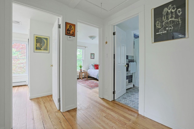 2 Amber Ridge Rd, Chestnut Ridge, NY 10977 - corridor featuring light wood-type flooring, baseboard heating, attic access, and baseboards