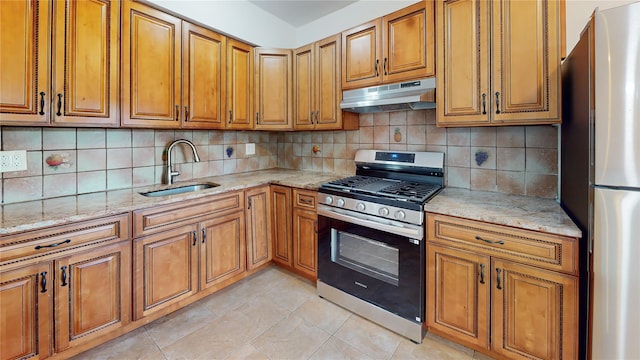 48-17 54th Ave, Maspeth, NY 11378 - kitchen featuring stainless steel appliances, a sink, under cabinet range hood, brown cabinets, and light stone countertops