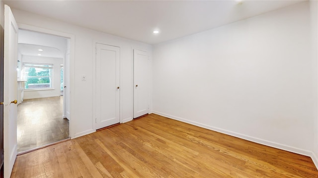 48-17 54th Ave, Maspeth, NY 11378 - unfurnished bedroom featuring light wood finished floors, recessed lighting, and baseboards