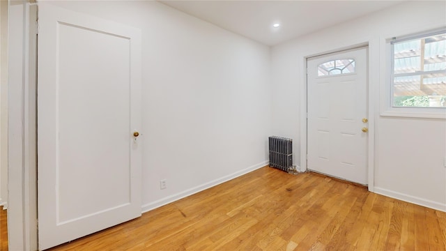 48-17 54th Ave, Maspeth, NY 11378 - entryway with light wood-style floors, baseboards, radiator, and recessed lighting