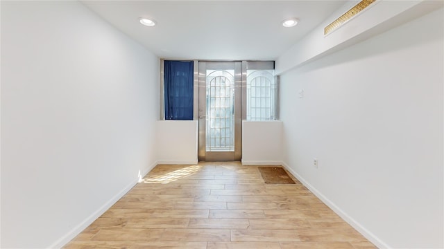 48-17 54th Ave, Maspeth, NY 11378 - doorway to outside featuring light wood finished floors, baseboards, and recessed lighting