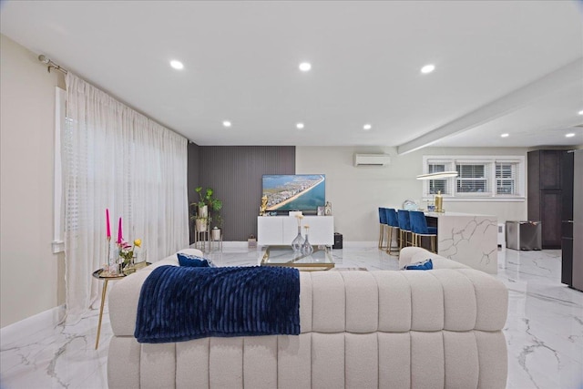 living room featuring marble tiled floors, a wall unit AC, recessed lighting, and baseboards