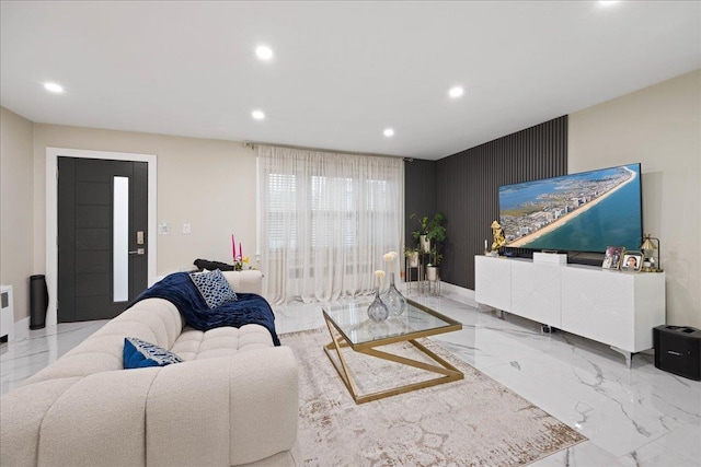 living room with recessed lighting, marble tiled flooring, and baseboards