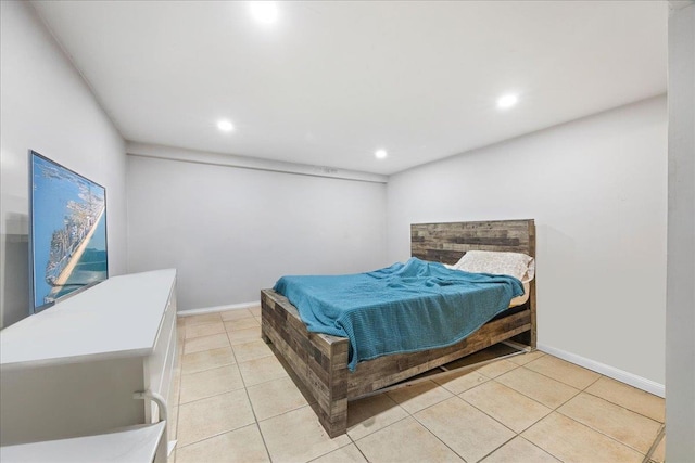 bedroom with recessed lighting, light tile patterned floors, and baseboards