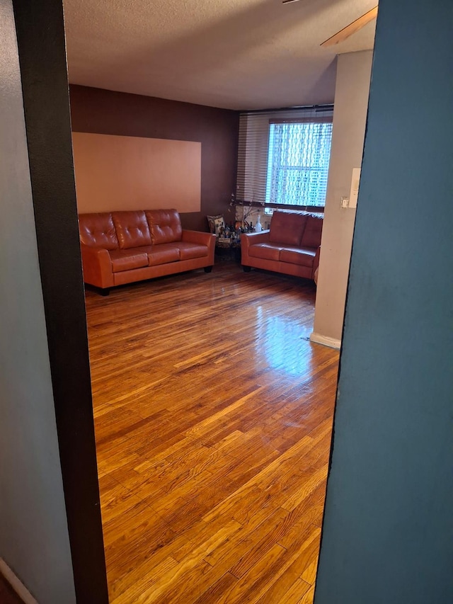 814B Tilden St # 4J, Bronx, NY 10467 - living room featuring wood finished floors and a textured ceiling