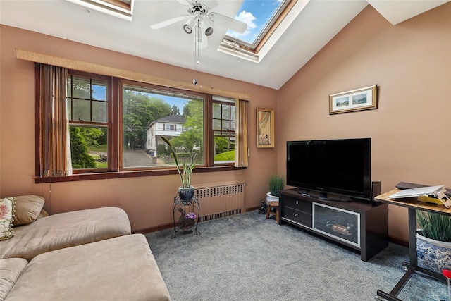 42 Longview Ave, White Plains, NY 10605 - carpeted living room with a skylight, radiator heating unit, a ceiling fan, and vaulted ceiling