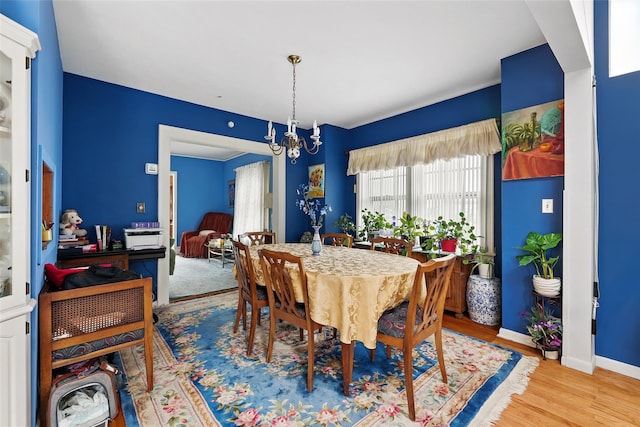42 Longview Ave, White Plains, NY 10605 - dining room with wood finished floors, a chandelier, and baseboards