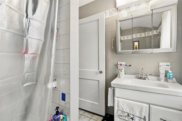 42 Longview Ave, White Plains, NY 10605 - full bathroom with tile walls, vanity, a shower with curtain, and tile patterned flooring