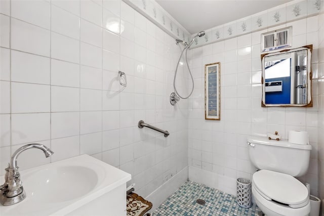 42 Longview Ave, White Plains, NY 10605 - bathroom with tile walls, a sink, tiled shower, toilet, and tile patterned flooring