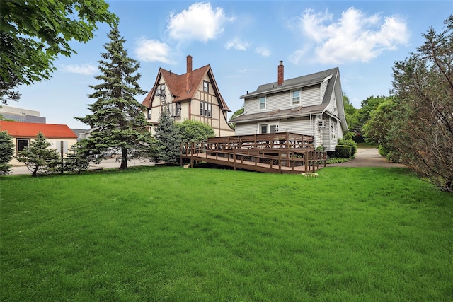 42 Longview Ave, White Plains, NY 10605 - rear view of house featuring a yard, a deck, and a chimney