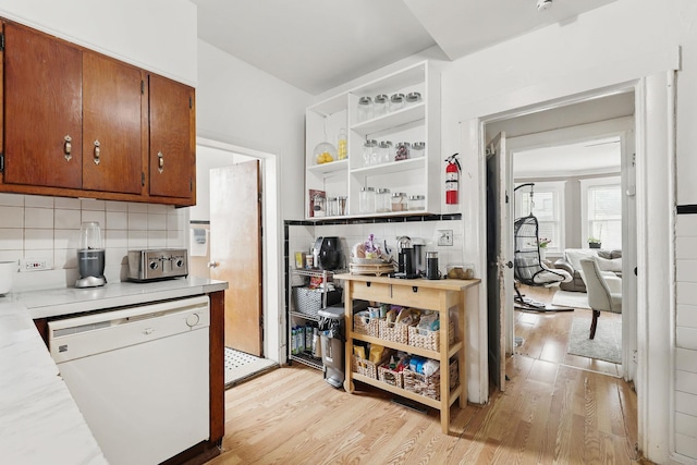 40 Longview Ave, White Plains, NY 10605 - kitchen with white dishwasher, light countertops, open shelves, and light wood-style floors