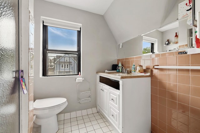 40 Longview Ave, White Plains, NY 10605 - bathroom with vanity, tile patterned floors, toilet, and lofted ceiling