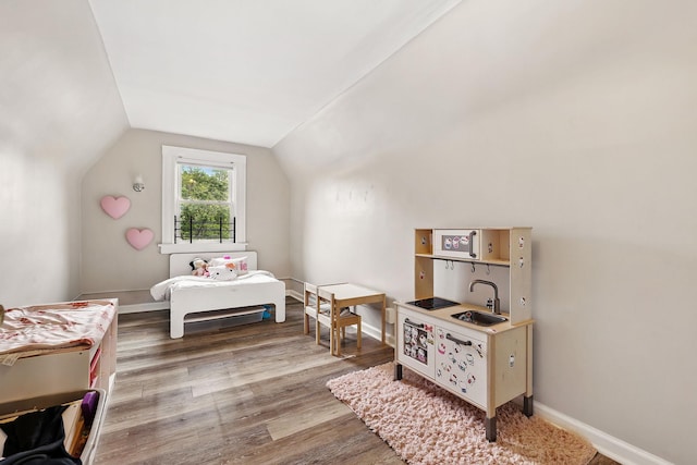 40 Longview Ave, White Plains, NY 10605 - bedroom with a sink, vaulted ceiling, wood finished floors, and baseboards