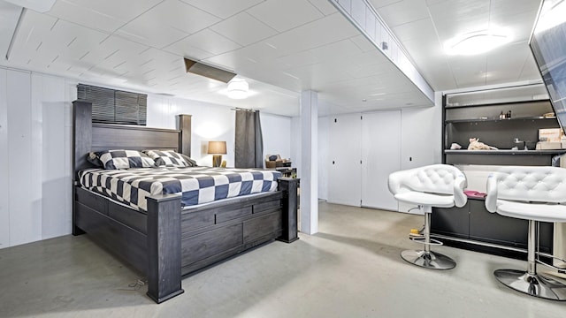 bedroom with finished concrete flooring
