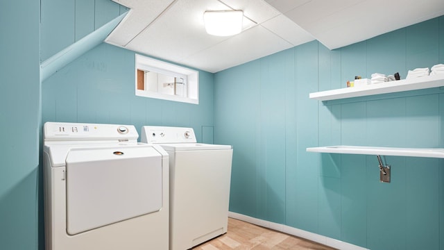 laundry room featuring independent washer and dryer and light wood finished floors