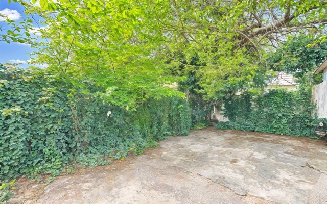 view of yard featuring a patio and fence