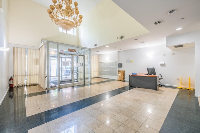 community lobby with a high ceiling and recessed lighting