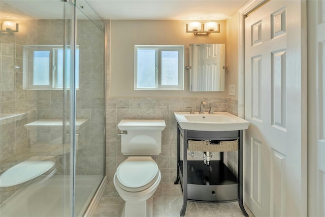 bathroom featuring a shower stall, toilet, and tile walls