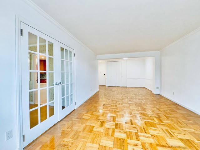 unfurnished room with french doors, baseboards, and crown molding