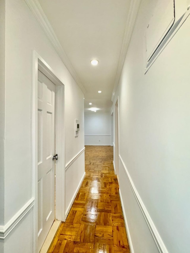 corridor with crown molding and recessed lighting