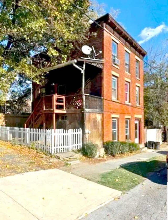 view of property with fence