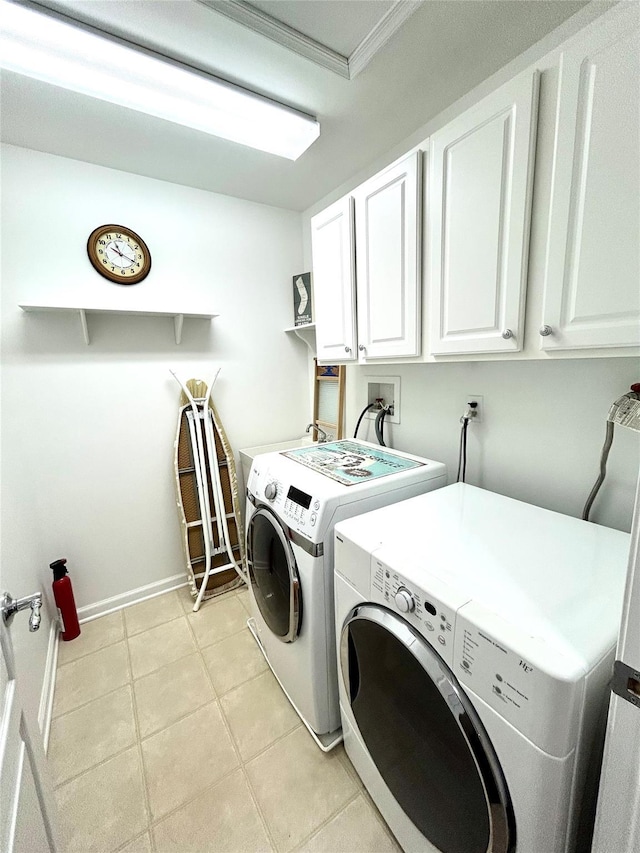 19 Brighton Dr Unit 1703, Newburgh, NY 12550 - washroom featuring cabinet space, washer and clothes dryer, light tile patterned floors, crown molding, and baseboards