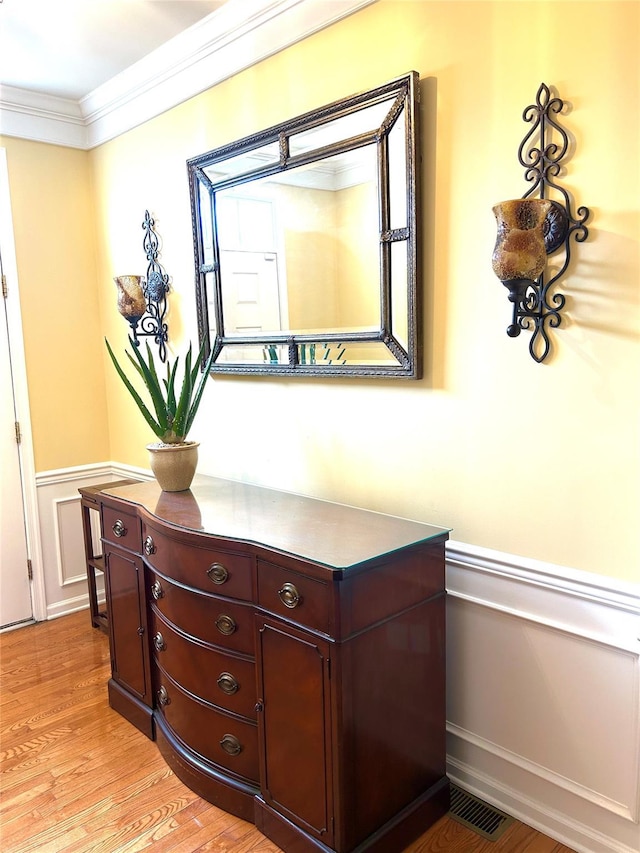 19 Brighton Dr Unit 1703, Newburgh, NY 12550 - detailed view of a wainscoted wall, wood finished floors, crown molding, and a decorative wall