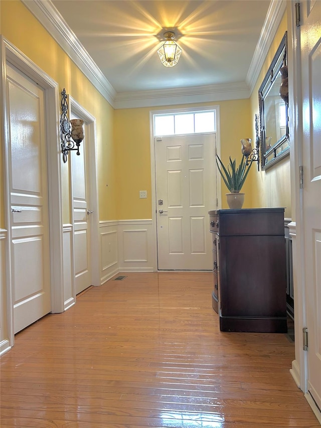 19 Brighton Dr Unit 1703, Newburgh, NY 12550 - foyer entrance with light wood-style flooring, wainscoting, ornamental molding, and a decorative wall