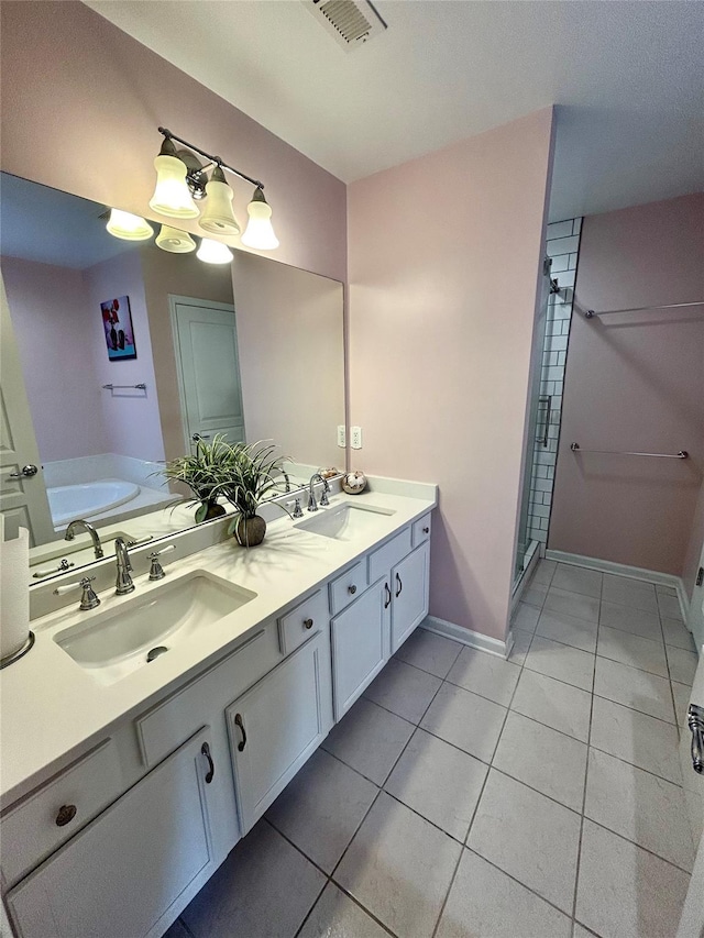 19 Brighton Dr Unit 1703, Newburgh, NY 12550 - full bath featuring double vanity, tile patterned floors, a shower stall, baseboards, and a garden tub