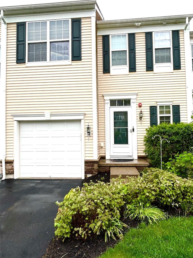 19 Brighton Dr Unit 1703, Newburgh, NY 12550 - view of front facade featuring a garage and driveway