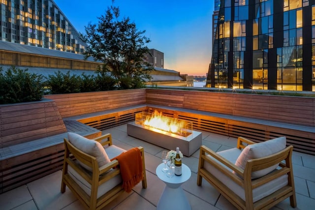 view of patio / terrace featuring an outdoor living space with a fire pit