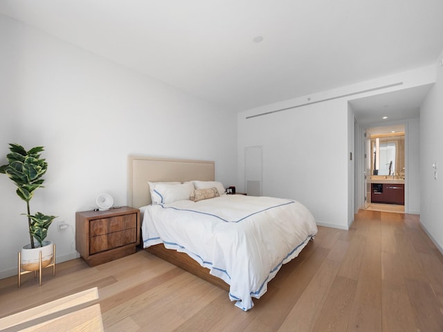 1 W End Ave Unit 26D, New York Manhattan, NY 10023 - bedroom with light wood finished floors, wet bar, and baseboards