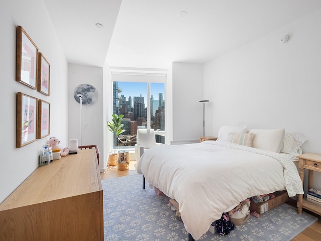 1 W End Ave Unit 26D, New York Manhattan, NY 10023 - bedroom featuring wood finished floors, a skyline view, and access to outside