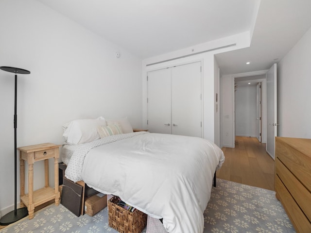 1 W End Ave Unit 26D, New York Manhattan, NY 10023 - bedroom with wood finished floors, a closet, and recessed lighting