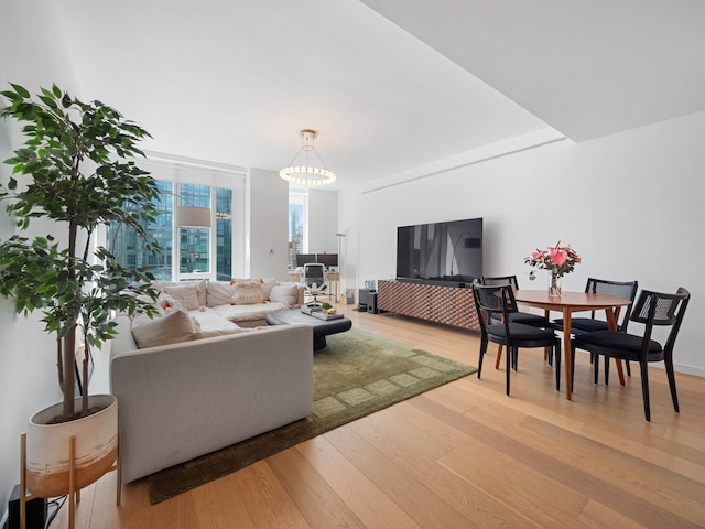 1 W End Ave Unit 26D, New York Manhattan, NY 10023 - living room featuring light wood-style floors and a chandelier