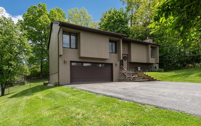 15 Marshall Dr, Poughkeepsie, NY 12601 - bi-level home featuring driveway, a garage, and a chimney