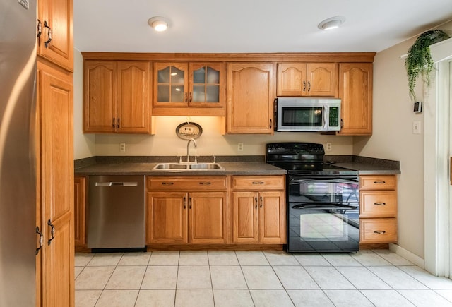 15 Marshall Dr, Poughkeepsie, NY 12601 - kitchen with appliances with stainless steel finishes, a sink, dark countertops, and glass insert cabinets