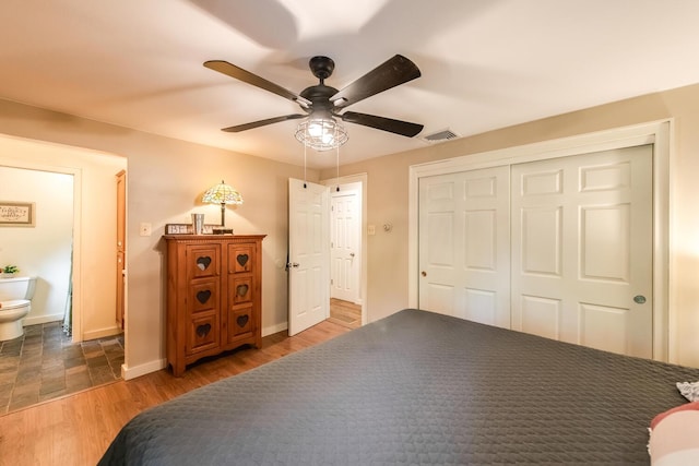 15 Marshall Dr, Poughkeepsie, NY 12601 - bedroom with wood finished floors, a closet, baseboards, ceiling fan, and ensuite bathroom