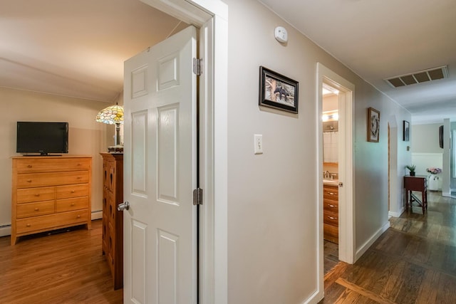 15 Marshall Dr, Poughkeepsie, NY 12601 - corridor with wood finished floors and a baseboard radiator