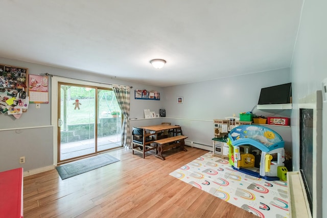 15 Marshall Dr, Poughkeepsie, NY 12601 - rec room with baseboard heating, wood finished floors, and baseboards