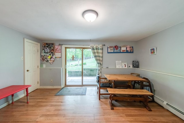 15 Marshall Dr, Poughkeepsie, NY 12601 - dining area with baseboard heating, light wood-style flooring, and baseboards