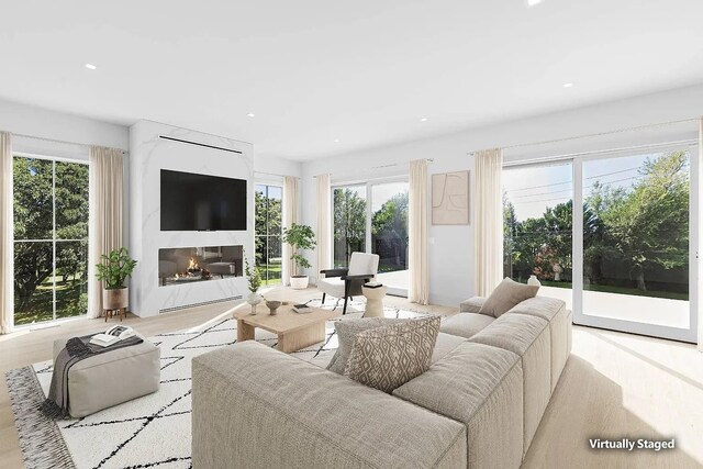 3 Dellaria Ave, Southampton, NY 11968 - living room featuring plenty of natural light, a fireplace, and recessed lighting