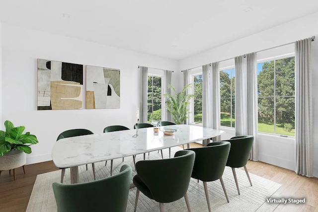 3 Dellaria Ave, Southampton, NY 11968 - dining space with light wood-style floors and baseboards