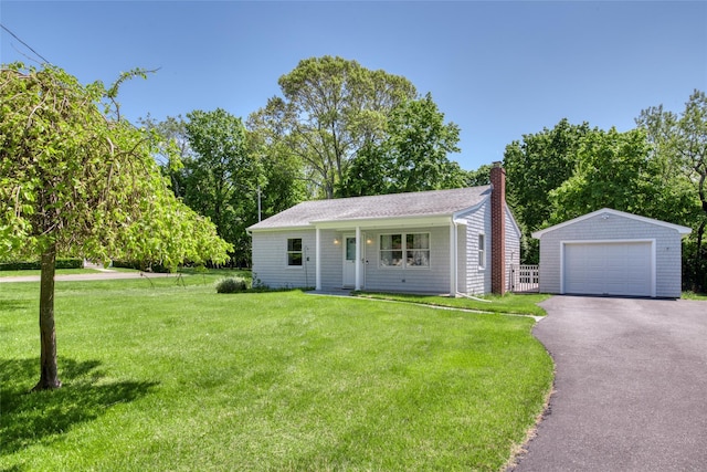 31 Bayberry Ln, Sag Harbor, NY 11963 - view of front of house featuring a garage, an outdoor structure, a chimney, a front lawn, and asphalt driveway