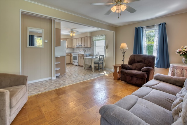 31 Bayberry Ln, Sag Harbor, NY 11963 - living area with a ceiling fan, healthy amount of natural light, baseboards, and ornamental molding