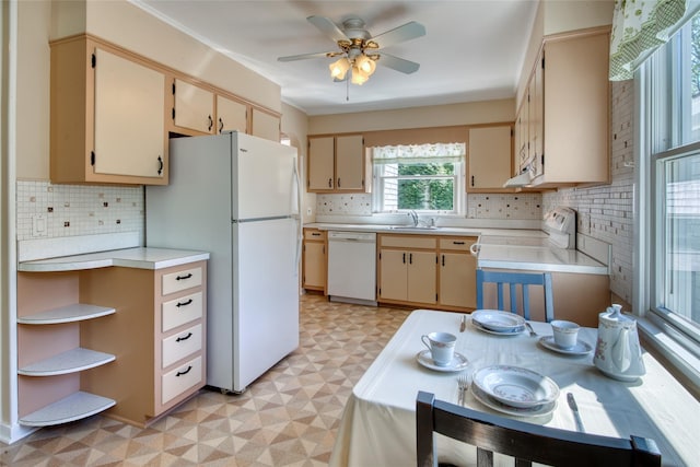 31 Bayberry Ln, Sag Harbor, NY 11963 - kitchen with white appliances, light floors, light countertops, a sink, and backsplash