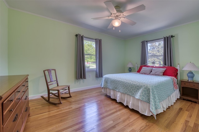 31 Bayberry Ln, Sag Harbor, NY 11963 - bedroom with light wood-style floors, crown molding, baseboards, and ceiling fan