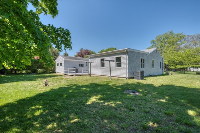31 Bayberry Ln, Sag Harbor, NY 11963 - back of property featuring cooling unit and a lawn