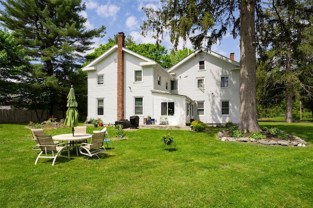 back of property featuring a chimney
